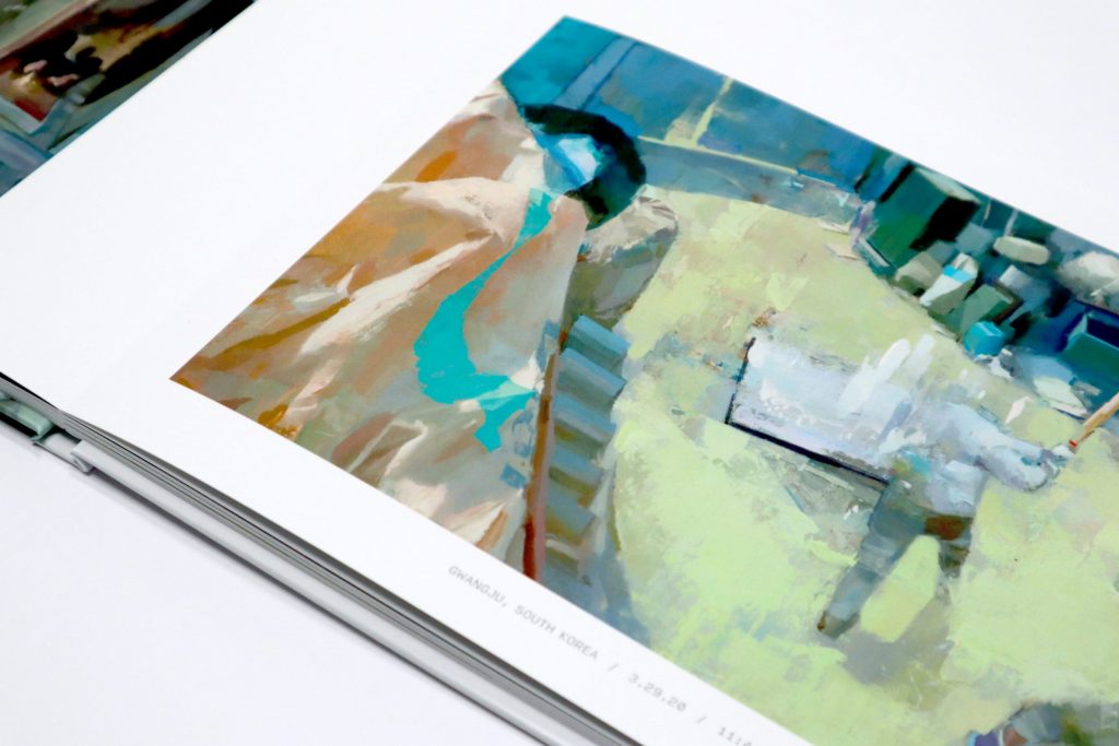Close up view of inner pages open to "Gwangju, South Korea" painting from "Surveillance" book