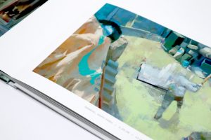 Close up view of inner pages open to "Gwangju, South Korea" painting from "Surveillance" book