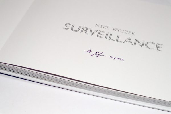 Close up view of signed title page from "Surveillance" book